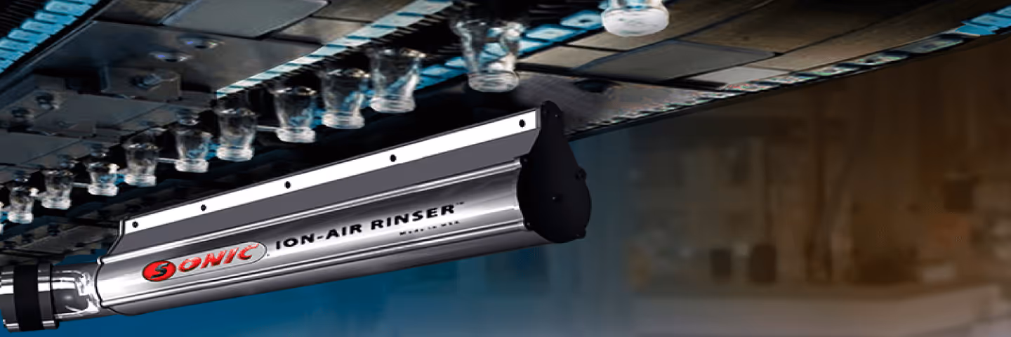 A metal-framed machine with a hose, identified as an ION-AIR Knife for static neutralizing applications.