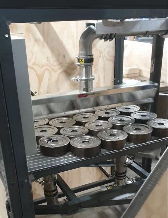Sonic rotary air knife cooling steel mandrels at Boride Engineered Abrasives.