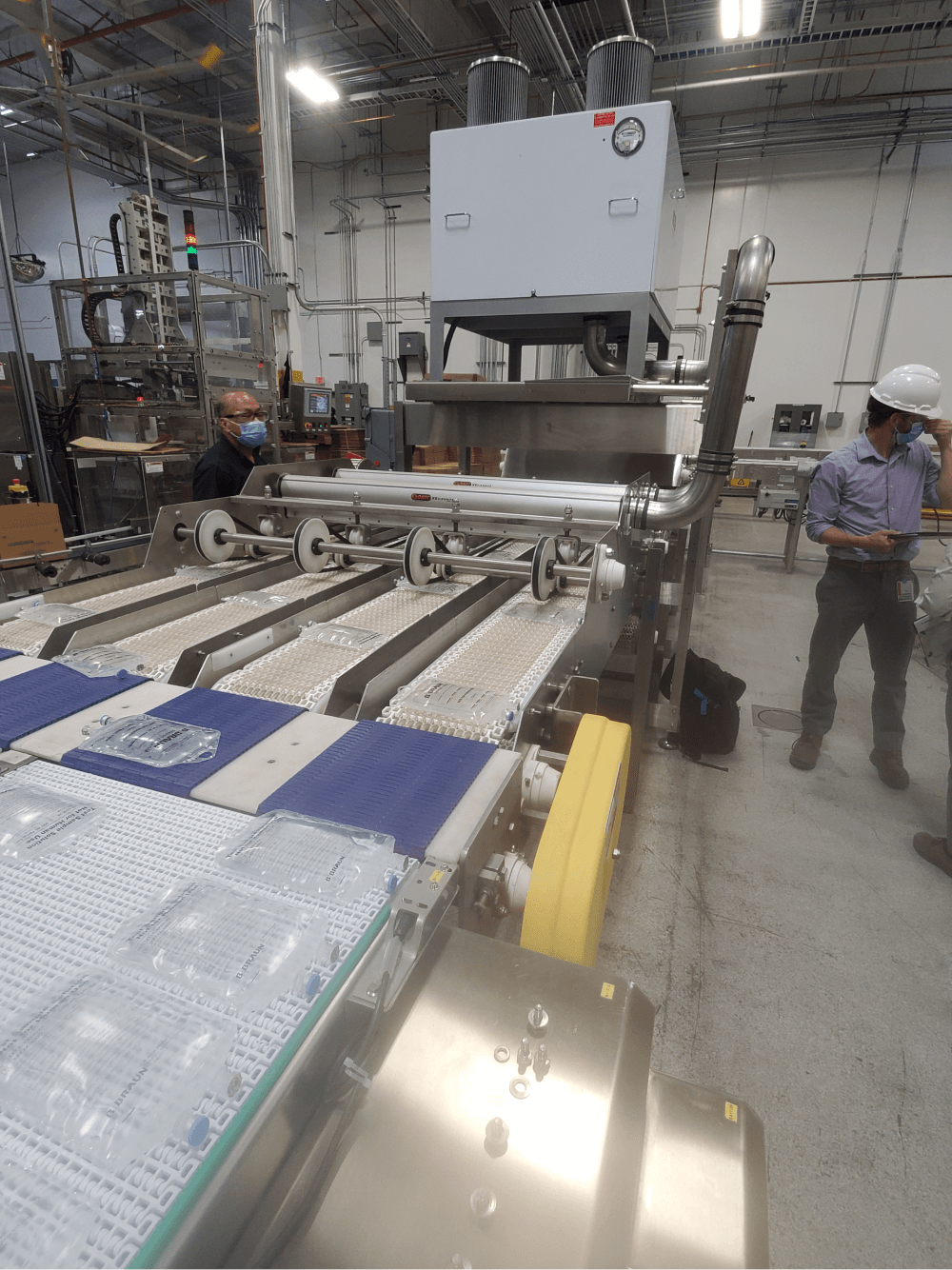 Sonic Air Systems industrial drying system for medical bags on a conveyor line